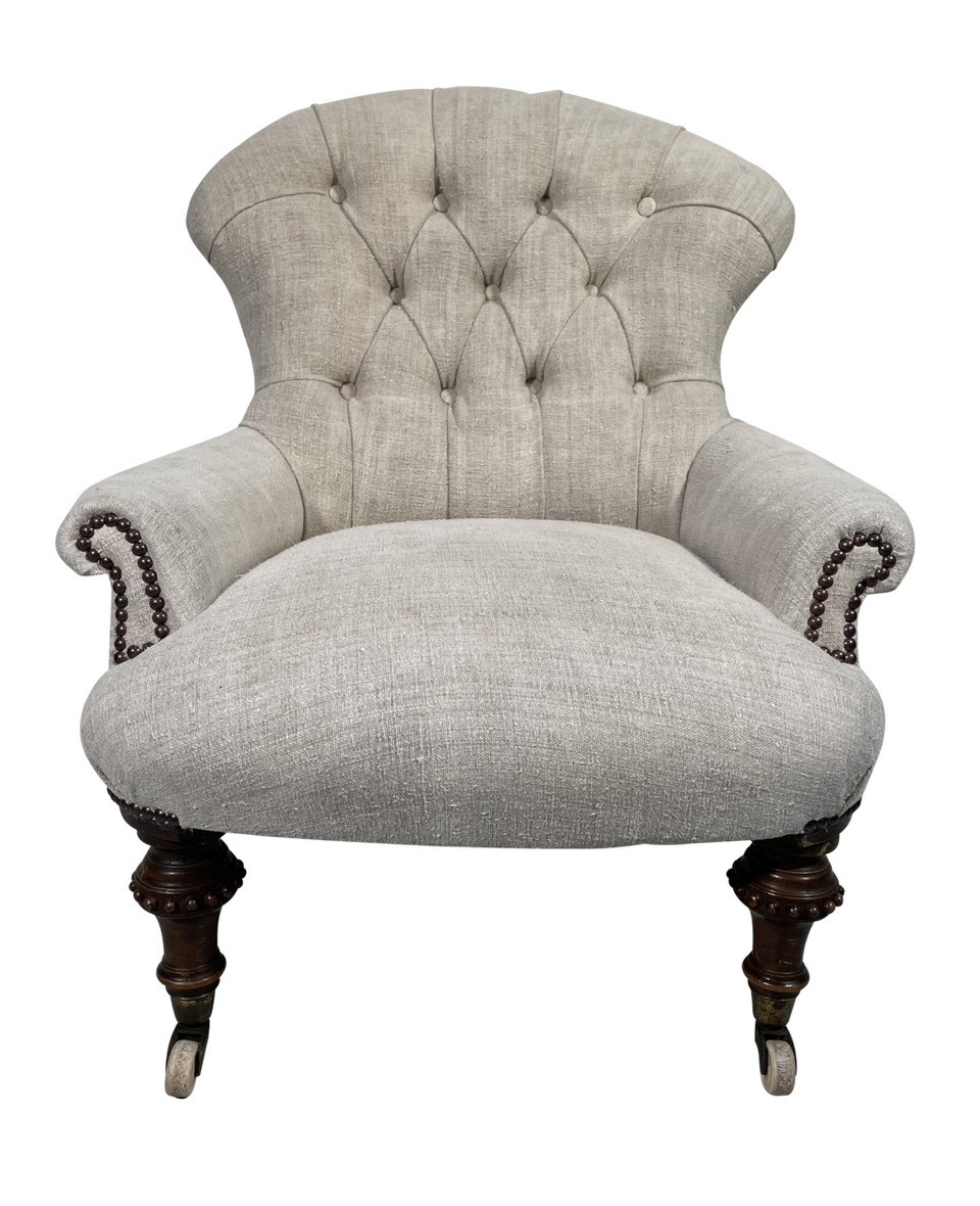 Early Victorian Button Back Armchair on Turned Mahogany Legs Upholstered in Antique French Hemp Linen