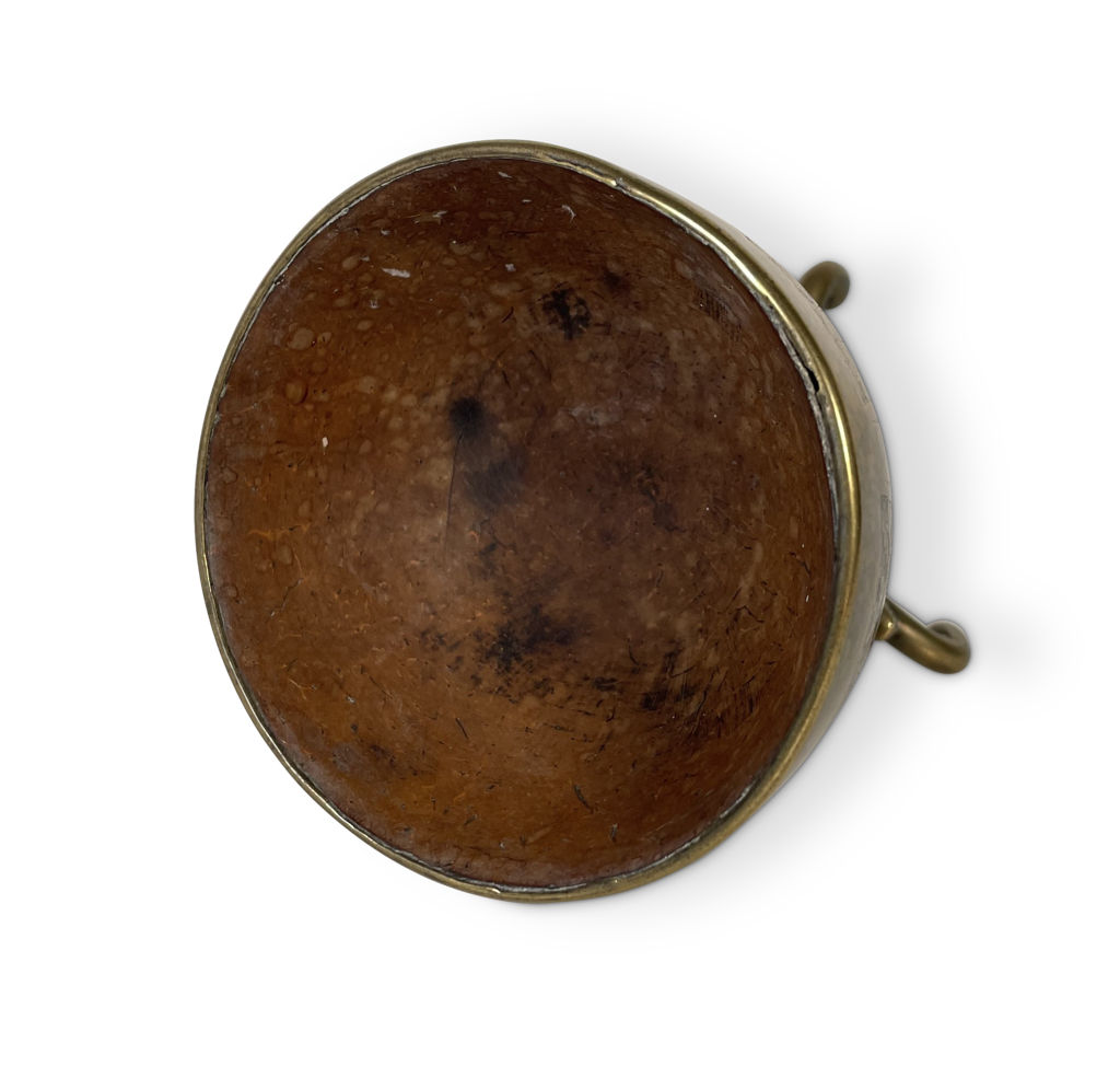Coconut Cup in a Pierced Brass Decorated Case Elevated on a Tripod Base