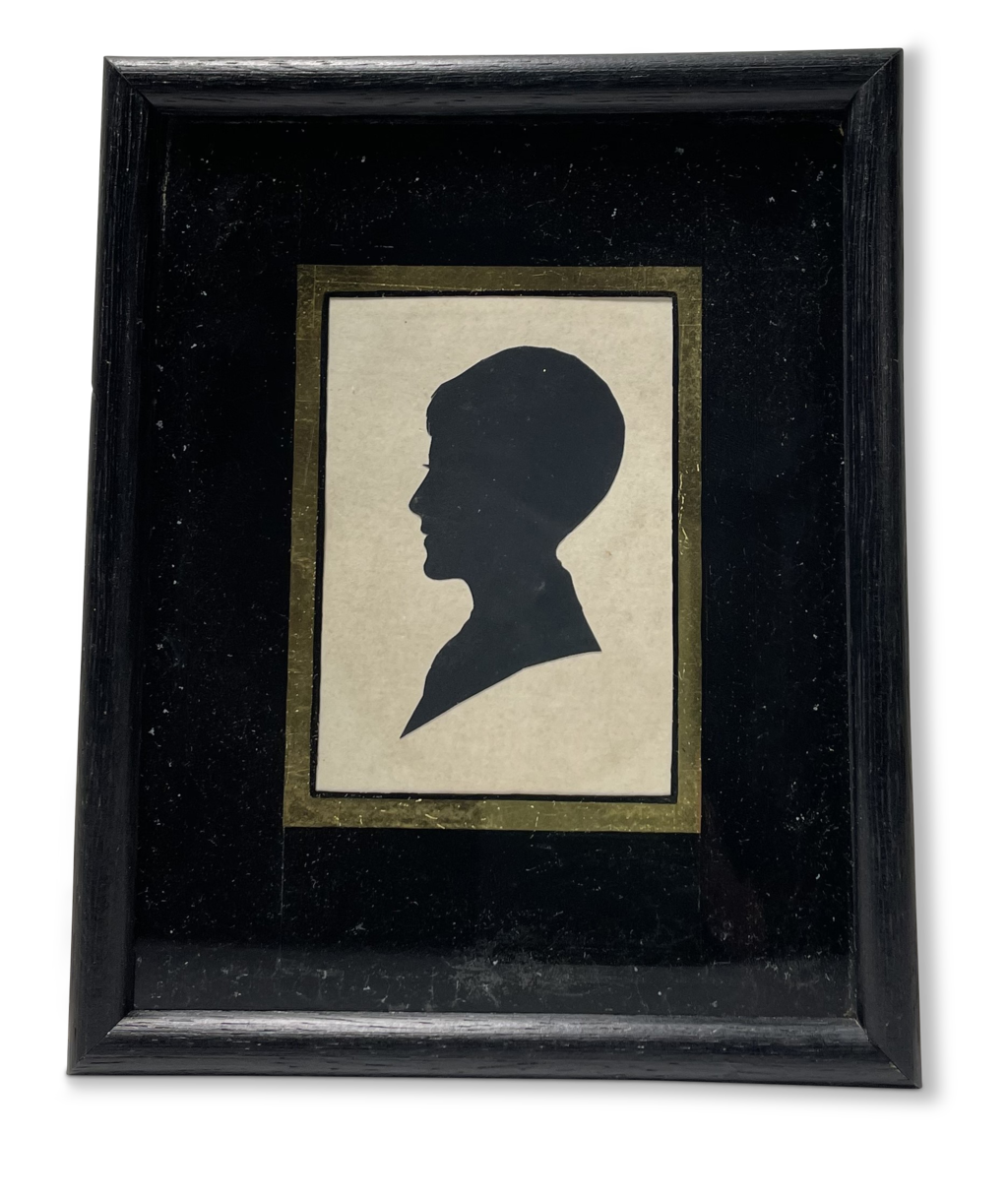 Silhouette Portrait of a Boy Mounted behind Glass in a Square Ebonsied Frame