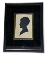 Silhouette Portrait of a Boy Mounted behind Glass in a Square Ebonsied Frame