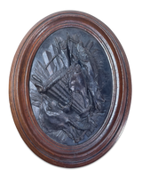 Cast Oval Plaque with Fishermans Basket and an Arrangement of Fish Mounted in a Oak Frame
